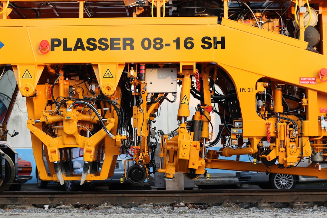 yellow and black train on rail tracks