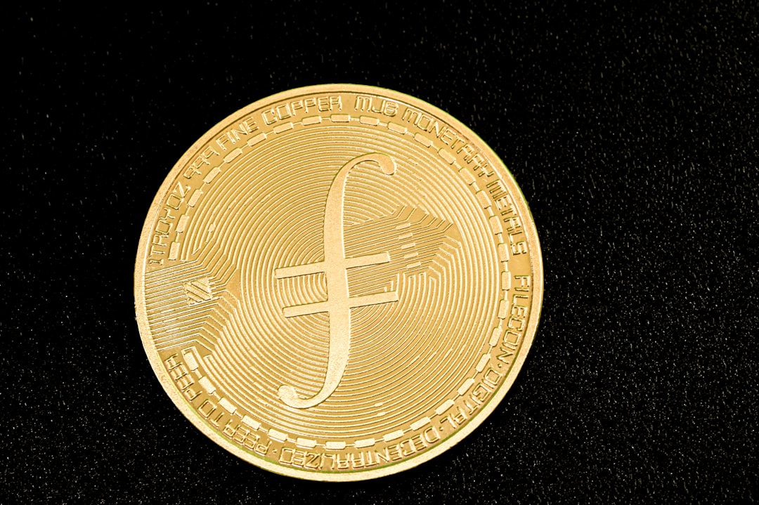 a gold coin with a cross on it