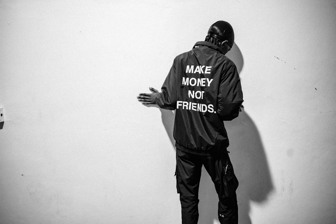 man in black and white adidas jacket and pants