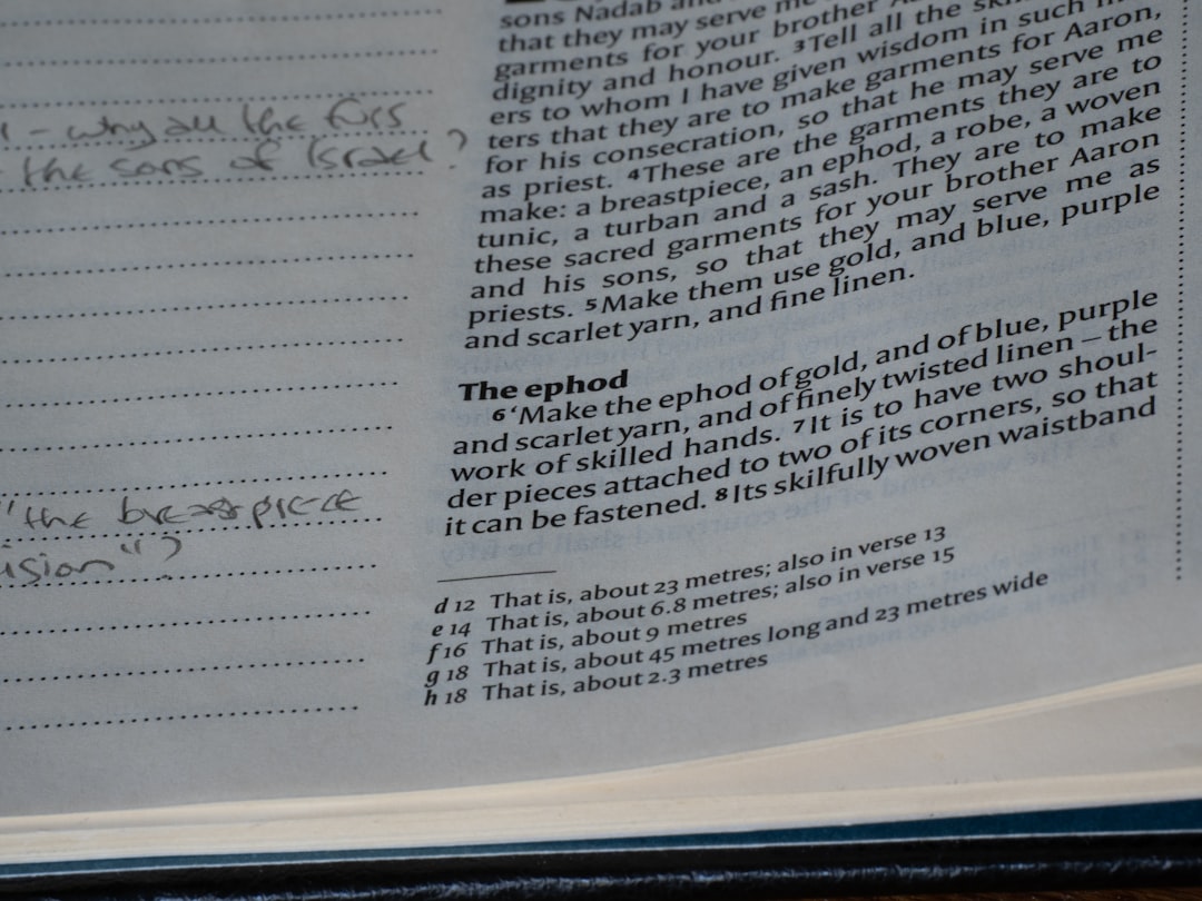 Close-up of handwritten notes beside printed text.