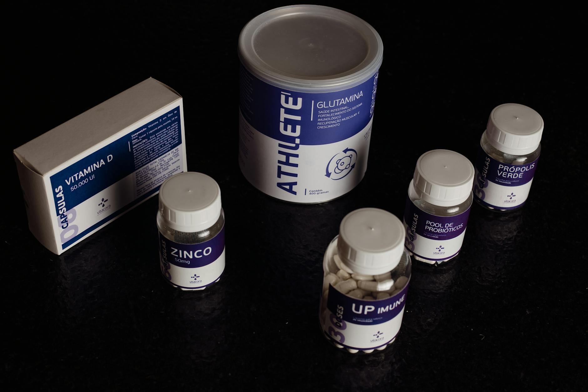 Close-up of a variety of nutritional supplements, vitamins, and probiotics.