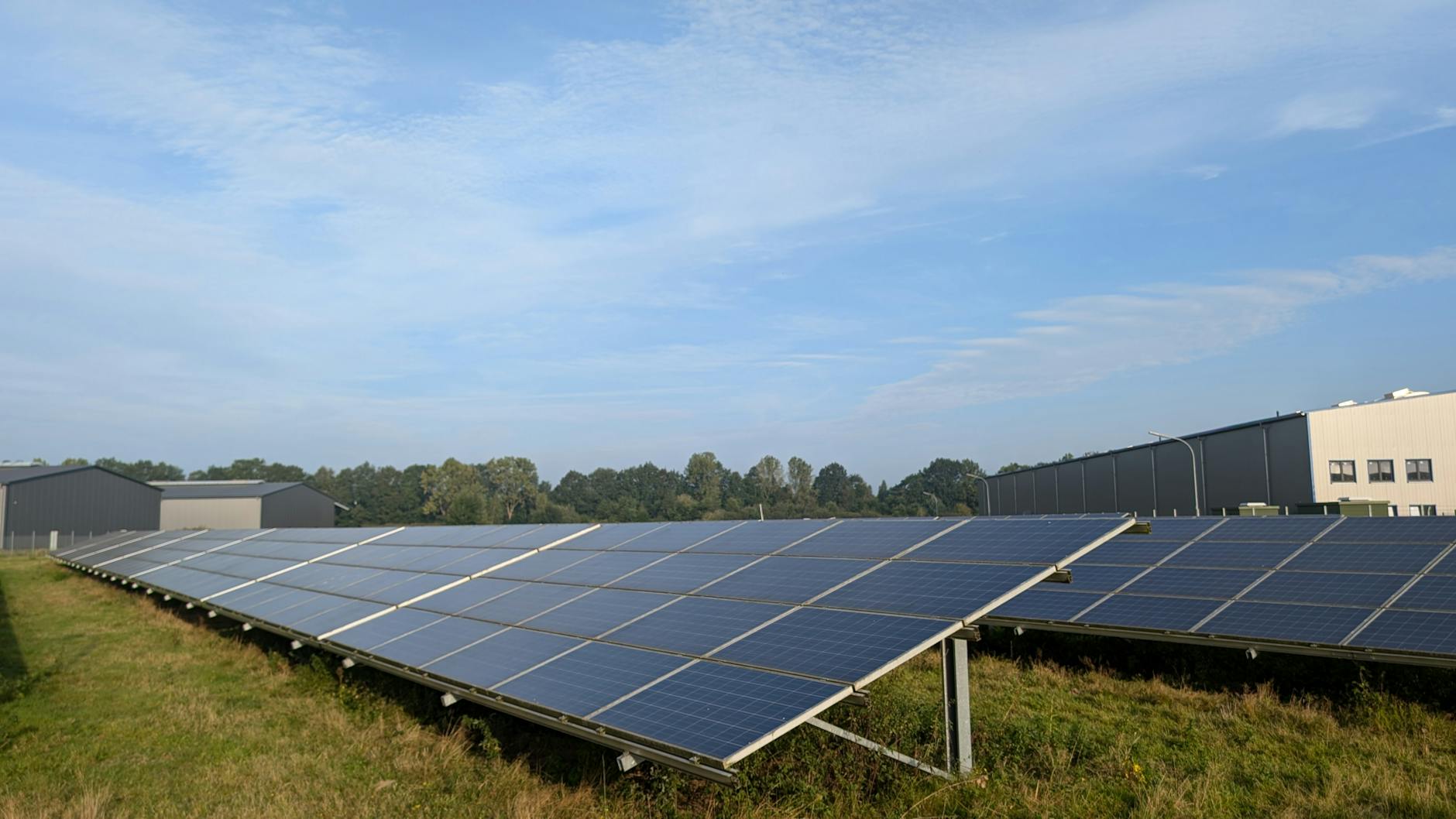Solar panels in a Ratzeburg field, capturing renewable energy on a clear day.