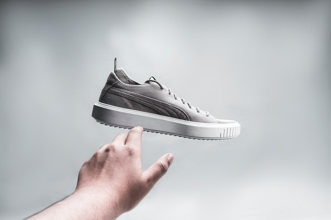 a person holding a shoe in their hand